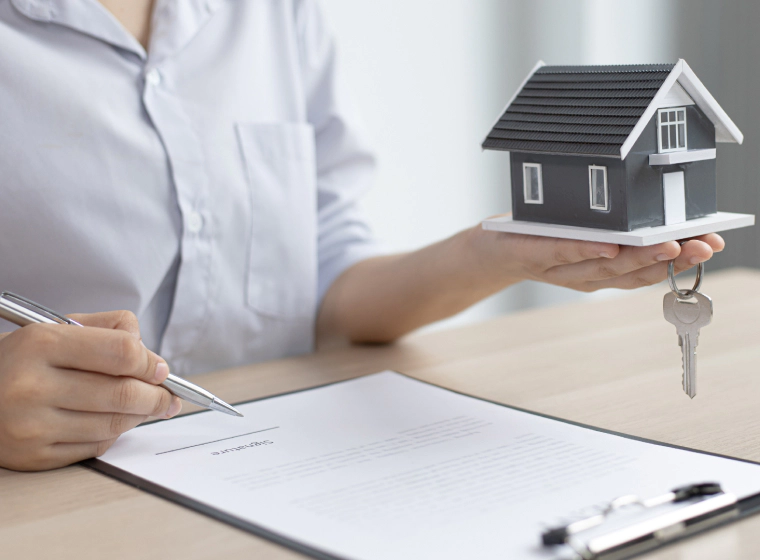 woman pre listing house holding mini scale model house plymouth MI woman pre listing house holding mini scale model house plymouth MI